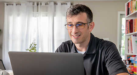 A man were eyeglasses and computer picture